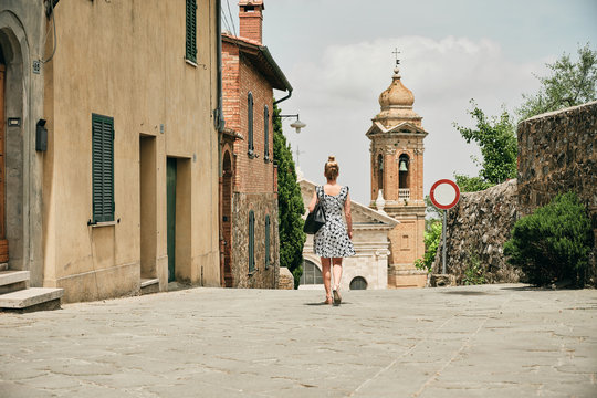 Woman Walking Along Old Street With Prohibition Sign To Chapel