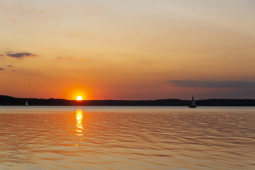 Fototapeta na wymiar The icreadible sunset over the Minsk Sea, Belarus