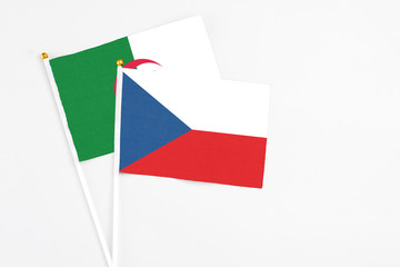 Czech Republic and Algeria stick flags on white background. High quality fabric, miniature national flag. Peaceful global concept.White floor for copy space.