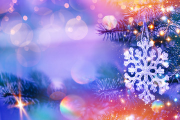 Obraz na płótnie Canvas Christmas and New Year holidays background. Glitter lights backdrop. Winter season. Text space. Closeup of Christmas-tree. Elements of this Image Furnished by NASA.