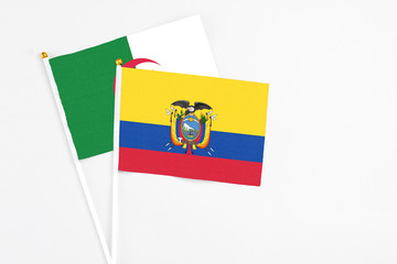Ecuador and Algeria stick flags on white background. High quality fabric, miniature national flag. Peaceful global concept.White floor for copy space.