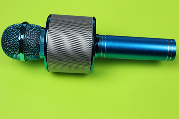 blue microphone on green background