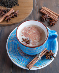 Obraz na płótnie Canvas cup of tea with cinnamon and star anise