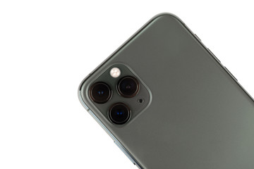 Smartphone on a white background. Smartphone with three cameras close-up.