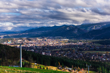 HDR photo of the Tatra Mountains and Great Giewont Peak with the steel Cross between clouds.