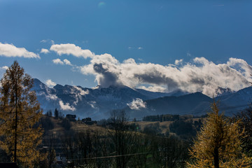 Fototapeta premium HDR photo of the Tatra Mountains and Great Giewont Peak with the steel Cross between clouds.