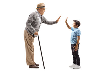 Grandson and grandfather gesturing high-five - obrazy, fototapety, plakaty