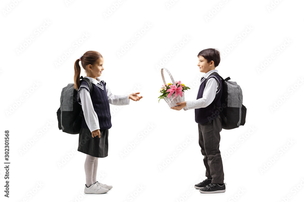 Sticker schoolboy giving a basket with flowers to a schoolgirl