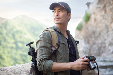 Chinese photographer taking photos in village