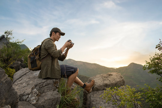 Chinese photographer taking photos outdoors