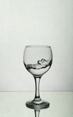 Splash of water in a wine glass