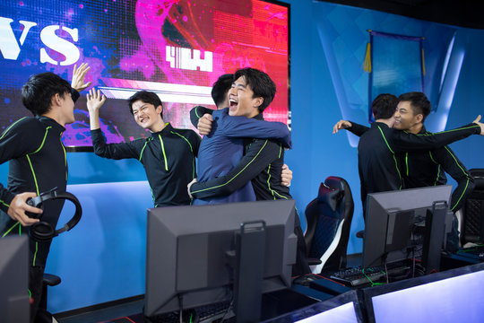 Young Chinese men playing esports