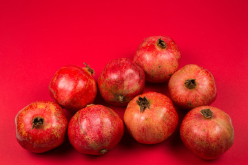 Fototapeta na wymiar Sweet pomegranate on red background.