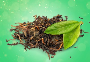Tea and leaves isolated on white background