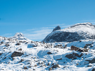 View on highest snow covered mountain peaks in Norway and Scandinavia, Jotunheimen National Park. Sunny day, blue sky background