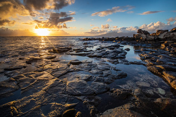Rocky Coastline with waves at sunset from Maui
