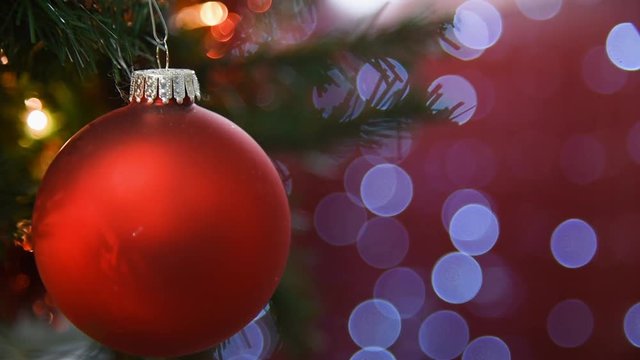 Christmas balls with red christmas light bokeh background