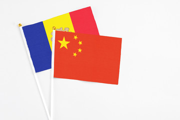 China and Andorra stick flags on white background. High quality fabric, miniature national flag. Peaceful global concept.White floor for copy space.