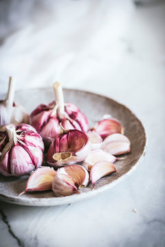 Close-up of a plate of pink garlic