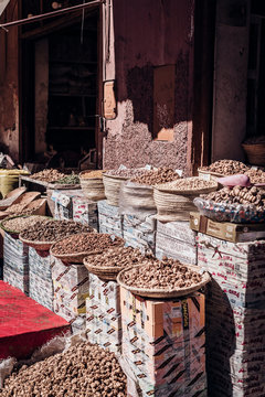 Wicker baskets with dried herbs placed on market on street of Marrakesh, Morocco
