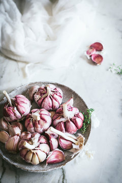 Close-up of a plate of pink garlic