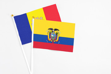 Ecuador and Andorra stick flags on white background. High quality fabric, miniature national flag. Peaceful global concept.White floor for copy space.