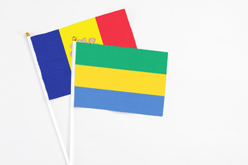 Gabon and Andorra stick flags on white background. High quality fabric, miniature national flag....