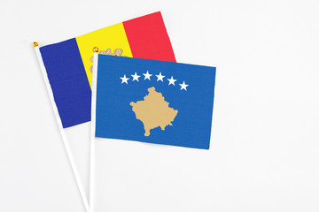 Kosovo and Andorra stick flags on white background. High quality fabric, miniature national flag. Peaceful global concept.White floor for copy space.