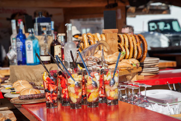 Bar counter with fruit dessert in glasses