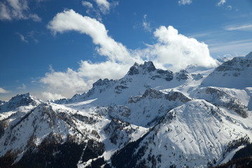 Fototapeta na wymiar mountain range in winter against the blue sky