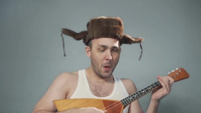 Video of singing drunk russian man with balalaika