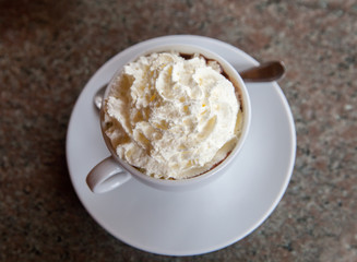 Cup of hot chocolate with whipped cream, top view