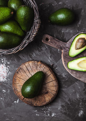 avocado on a cutting board with a kitchen towel in a vintage style