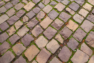 Ancient old yellow grey stone road background texture.
