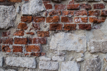 Ancient old castle white stone and red brick wall background.