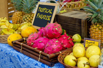 Tropical fruit display of guava, star fruit, pineapple, and dragon fruit