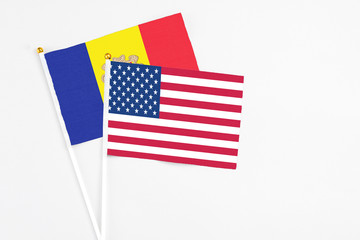 United States and Andorra stick flags on white background. High quality fabric, miniature national flag. Peaceful global concept.White floor for copy space.