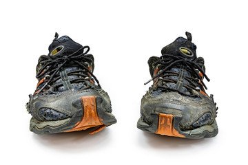 old running shoes on a white background