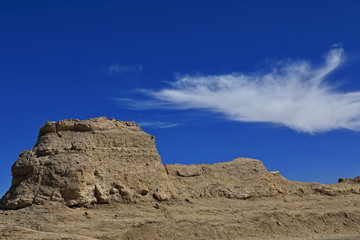 Cirrus uncinus cloud over wind-eroded trailer van-shaped yardang. Qaidam desert-Qinghai-China-0587