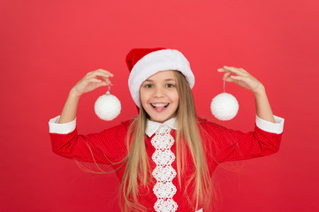 Christmas decor. Winter holidays. Playful mood. Snowball concept. Happy kid. Add some decorations. Christmas decorating ideas. Child Santa Claus costume hold christmas balls. Universal decorations