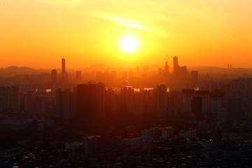 The orange sunset over the city of Seoul