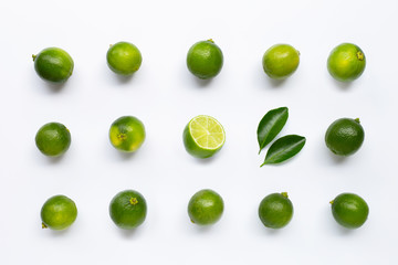 Fresh limes with leaves isolated on white