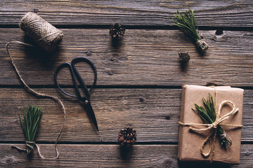 Hand made craft gifts of paper with ribbon at Christmas holiday and presents. On wooden background,