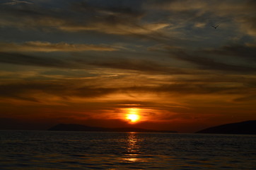  sea, sunset, island,sky,clouds