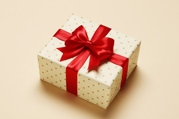 Gift box with a red bow on a colored background. place for text. Top view.