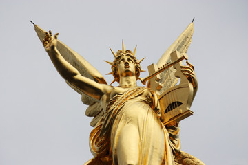 Fototapeta na wymiar detail of the golden statue above the opera house of Paris