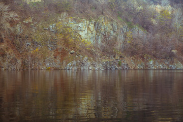 Autumn lake with rocks