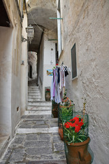 Fototapeta premium Atrani, Italy, 12/12/2017. The narrow street among the old houses of a coastal village