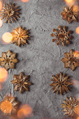 Obraz na płótnie Canvas New Year's straw toys, on a gray concrete background. Christmas card
