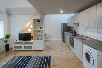 Light interior of room in apartment. Private house. Living room and kitchen.